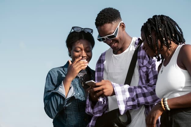 Side view of friends using a smartphone